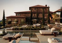 BOA Hotels chega ao Douro com resort de cinco estrelas a mil metros de altitude Representação do resort KURA da BOA Hotels no Douro, com piscina exterior, edifícios em pedra e zonas de descans
